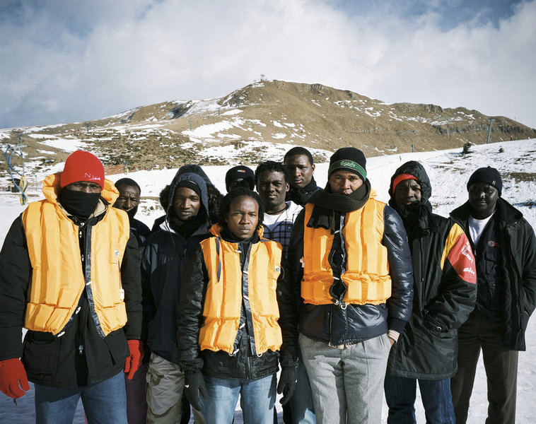 These african imigrants arrived by boat in Lampedusa in 2011. Upon decision of the Italian government to empty the Lamedusa camp, they were sent to Monte Campione a Ski resort at 1800m altitude in July 2011. They were left there for 4 months with nothing to do and almost no contact whith the outside world. In Oct. 2011 thanks to a strike they were sent by group of 2 or 3 in the various villages of the Camonica valley for an experiment of micro integration while waiting for the status to be clarified. Here, in Feb 2012, 4 months after having left it they came back to Montecampione. © Joan Bardeletti